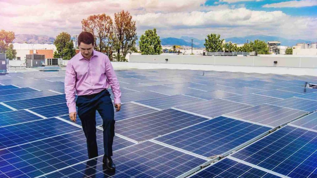 Photo of LASG founder Ara Petrosyan looking at a solar installation